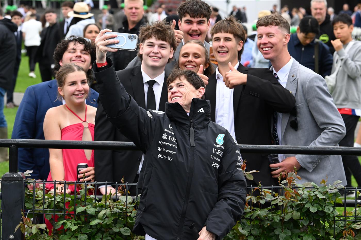 MELBOURNE, AUSTRALIA - OCTOBER 03: Craig Williams poses with young race goers during Turnbull Stakes Day at Flemington Racecourse on October 03, 2026 in Melbourne, Australia. (Photo by Vince Caligiuri/Getty Images)