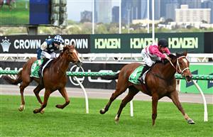 MELBOURNE, AUSTRALIA - OCTOBER 03: William Pike riding Cosmic Crusader defeats Light Infantry Man in race 8, the Tab Turnbull Stakes  during Turnbull Stakes Day at Flemington Racecourse on October 03, 2026 in Melbourne, Australia. (Photo by Vince Caligiuri/Getty Images)
