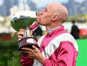 MELBOURNE, AUSTRALIA - OCTOBER 03: William Pike poses with trophy after riding Cosmic Crusader to win race 8, the Tab Turnbull Stakes  during Turnbull Stakes Day at Flemington Racecourse on October 03, 2026 in Melbourne, Australia. (Photo by Vince Caligiuri/Getty Images)