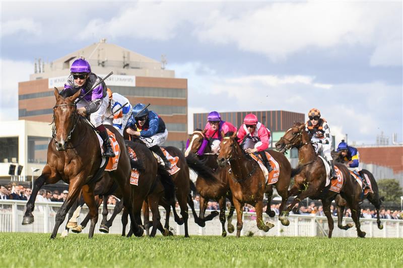 MELBOURNE, AUSTRALIA - OCTOBER 14: Ben Melham riding Griff defeats Damian Lane riding Veight and Steparty in winning Race 9, the Neds Caulfield Guineas, during Melbourne Racing at Caulfield Racecourse on October 14, 2023 in Melbourne, Australia. (Photo by Vince Caligiuri/Getty Images)