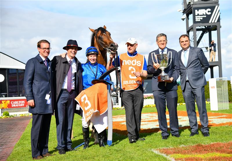 MELBOURNE, AUSTRALIA - OCTOBER 08: James McDonald poses with Trainer James Cummings and connections after riding Golden Mile to win Race 8, the Neds Caulfield Guineas,  during Caulfield Guineas Day at Caulfield Racecourse on October 08, 2022 in Melbourne, Australia. (Photo by Vince Caligiuri/Getty Images)