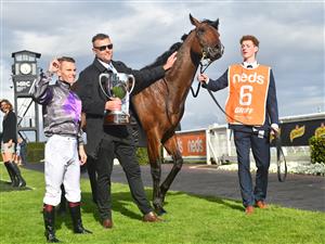 MELBOURNE, AUSTRALIA - OCTOBER 14: Ben Melham after  riding Griff to win Race 9, the Neds Caulfield Guineas, during Melbourne Racing at Caulfield Racecourse on October 14, 2023 in Melbourne, Australia. (Photo by Vince Caligiuri/Getty Images)