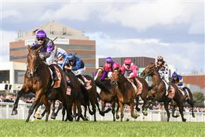 MELBOURNE, AUSTRALIA - OCTOBER 14: Ben Melham riding Griff defeats Damian Lane riding Veight and Steparty in winning Race 9, the Neds Caulfield Guineas, during Melbourne Racing at Caulfield Racecourse on October 14, 2023 in Melbourne, Australia. (Photo by Vince Caligiuri/Getty Images)
