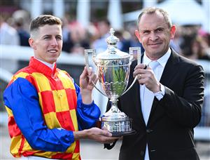 MELBOURNE, AUSTRALIA - OCTOBER 11: Damian Lane poses with Trainer Chris Waller after riding Autumn Boy to win Race 8, the Sportsbet Caulfield Guineas during Melbourne Racing at Caulfield Racecourse on October 11, 2025 in Melbourne, Australia. (Photo by Vince Caligiuri/Getty Images)