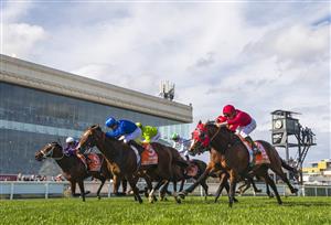 MELBOURNE, AUSTRALIA - OCTOBER 08: James McDonald riding Golden Mile (ctr) defaets Elliptical and Osipenko (L) in Race 8, the Neds Caulfield Guineas,  during Caulfield Guineas Day at Caulfield Racecourse on October 08, 2022 in Melbourne, Australia. (Photo by Vince Caligiuri/Getty Images)