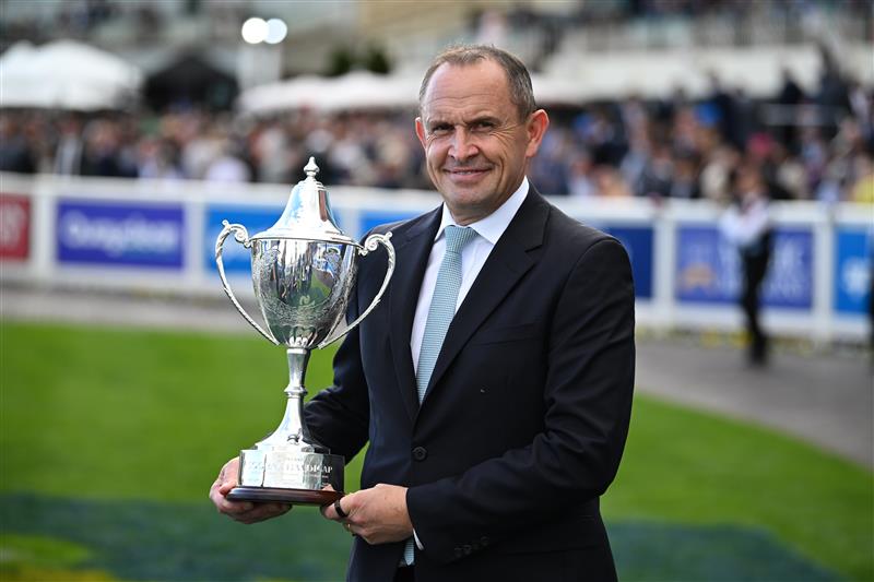 MELBOURNE, AUSTRALIA - OCTOBER 10: Trainer Chris Waller poses with trophy after Lady Shenandoah won race 9, the Hyland Race Colours Toorak Handicap  during Melbourne Racing at Caulfield Racecourse on October 10, 2026 in Melbourne, Australia. (Photo by Vince Caligiuri/Getty Images)