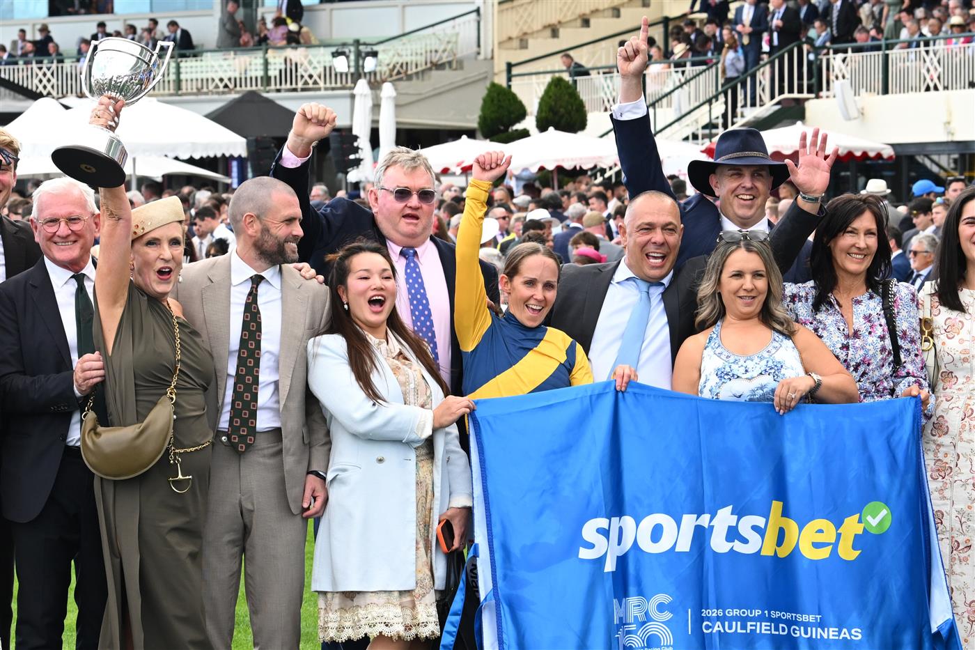 MELBOURNE, AUSTRALIA - OCTOBER 10: Rachel King celebrates with connections after riding Warwoven to win race 8, the Sportsbet Caulfield Guineas during Melbourne Racing at Caulfield Racecourse on October 10, 2026 in Melbourne, Australia. (Photo by Vince Caligiuri/Getty Images)