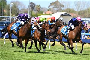 MELBOURNE, AUSTRALIA - OCTOBER 10: James McDonald riding Pinhole winning from Daniel Stackhouse riding Suntora and Blake Shinn riding Knight