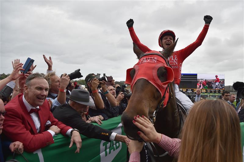 Jockey Kerrin McEvoy celebrates on Redzel after they won the Everest 2017 horse race, the world richest turf race at Royal Randwick race course in Sydney on October 14, 2017. / AFP PHOTO / PETER PARKS / -- IMAGE RESTRICTED TO EDITORIAL USE - STRICTLY NO COMMERCIAL USE --        (Photo credit should read PETER PARKS/AFP via Getty Images)
