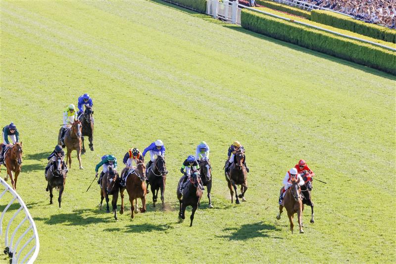 SYDNEY, AUSTRALIA - OCTOBER 15: Craig Williams (red and white) on Giga Kick wins race 7 The Tab Everest during Everest Day at Royal Randwick Racecourse on October 15, 2022 in Sydney, Australia. (Photo by Jenny Evans/Getty Images)