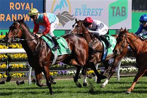 Ka Ying Rising (L), ridden by jockey Zac Purton, wins The Everest 2025 race at the Royal Randwick racecourse in Sydney on October 18, 2025.  (Photo by DAVID GRAY / AFP) / -- IMAGE RESTRICTED TO EDITORIAL USE - STRICTLY NO COMMERCIAL USE -- (Photo by DAVID GRAY/AFP via Getty Images)          
