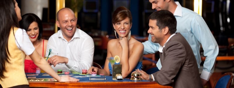 Group playing at blackjack table