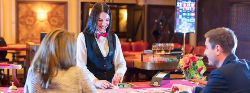 Woman dealer at blackjack table