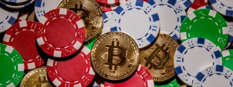 Bitcoin and casino chips in pile Bitcoin and casino chips in pile