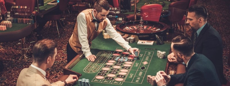 Live casino dealer at the roulette table Live casino dealer at the roulette table