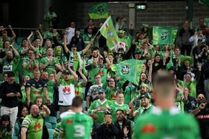 SYDNEY, AUSTRALIA - OCTOBER 09: Raiders fans celebrate after winning the NRL Semi Final match between the Sydney Roosters and the Canberra Raiders at the Sydney Cricket Ground on October 09, 2020 in Sydney, Australia. (Photo by Cameron Spencer/Getty Images)