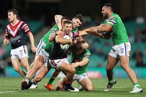 SYDNEY, AUSTRALIA - OCTOBER 09: James Tedesco of the Roosters is tackled during the NRL Semi Final match between the Sydney Roosters and the Canberra Raiders at the Sydney Cricket Ground on October 09, 2020 in Sydney, Australia. (Photo by Cameron Spencer/Getty Images)