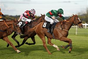 WINCANTON, ENGLAND - OCTOBER 15: Charlie Deutsch riding Thahab Ifraj (green) clear the last to win The Racing TV HD On Sky 426 Handicap Hurdle at Wincanton Racecourse on October 15, 2020 in Wincanton, England. Owners are allowed to attend if they have a runner at the meeting otherwise racing remains behind closed doors to the public due to the Coronavirus pandemic. (Photo by Alan Crowhurst/Getty Images)