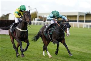 WINCANTON, ENGLAND - OCTOBER 15: Lilly Pinchin riding Follow The Swallow (R) clear the last to win The Over 40 Free RacingTV Club Days Handicap Chase at Wincanton Racecourse on October 15, 2020 in Wincanton, England. Owners are allowed to attend if they have a runner at the meeting otherwise racing remains behind closed doors to the public due to the Coronavirus pandemic. (Photo by Alan Crowhurst/Getty Images)