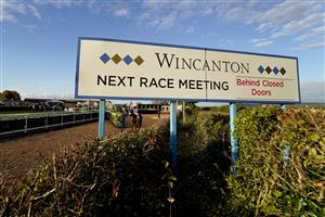 WINCANTON, ENGLAND - OCTOBER 15: A general view as a runner and rider make their way to the track at Wincanton Racecourse on October 15, 2020 in Wincanton, England. Owners are allowed to attend if they have a runner at the meeting otherwise racing remains behind closed doors to the public due to the Coronavirus pandemic. (Photo by Alan Crowhurst/Getty Images)