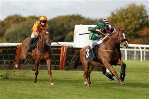 WINCANTON, ENGLAND - OCTOBER 15: Charlie Deutsch riding Thahab Ifraj (green) clear the last to win The Racing TV HD On Sky 426 Handicap Hurdle at Wincanton Racecourse on October 15, 2020 in Wincanton, England. Owners are allowed to attend if they have a runner at the meeting otherwise racing remains behind closed doors to the public due to the Coronavirus pandemic. (Photo by Alan Crowhurst/Getty Images)