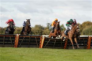 WINCANTON, ENGLAND - OCTOBER 15: Charlie Deutsch riding Thahab Ifraj (green) clear the last to win The Racing TV HD On Sky 426 Handicap Hurdle at Wincanton Racecourse on October 15, 2020 in Wincanton, England. Owners are allowed to attend if they have a runner at the meeting otherwise racing remains behind closed doors to the public due to the Coronavirus pandemic. (Photo by Alan Crowhurst/Getty Images)