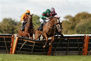 WINCANTON, ENGLAND - OCTOBER 15: Charlie Deutsch riding Thahab Ifraj (green) clear the last to win The Racing TV HD On Sky 426 Handicap Hurdle at Wincanton Racecourse on October 15, 2020 in Wincanton, England. Owners are allowed to attend if they have a runner at the meeting otherwise racing remains behind closed doors to the public due to the Coronavirus pandemic. (Photo by Alan Crowhurst/Getty Images)