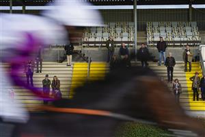 WINCANTON, ENGLAND - OCTOBER 15: Harry Cobden riding Celestial Force pass the owners grandstand on their way to winning The Bet At racingtv.com Novices' Hurdle at Wincanton Racecourse on October 15, 2020 in Wincanton, England. Owners are allowed to attend if they have a runner at the meeting otherwise racing remains behind closed doors to the public due to the Coronavirus pandemic. (Photo by Alan Crowhurst/Getty Images)