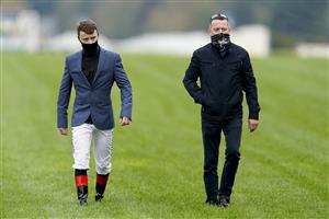 ASCOT, ENGLAND - OCTOBER 17: Father and son, Cieren Fallon (L) and his father Kieren walk the course during the Qipco British Champions Day at Ascot Racecourse on October 17, 2020 in Ascot, England. Owners are allowed to attend if they have a runner at the meeting otherwise racing remains behind closed doors to the public due to the Coronavirus pandemic. (Photo by Alan Crowhurst/Getty Images)