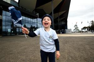 GEELONG, AUSTRALIA - OCTOBER 21: Three year old Will Tefer is seen at GMHBA Stadium on October 21, 2020 in Geelong, Australia. The Geelong Cats take on Richmond Tigers in the AFL Grand Final on Saturday 24 October at the Gabba in Brisbane. It is the first time the AFL Grand Final has been played outside of the MCG due to COVID-19 restrictions.. Coronavirus restrictions eased further in Victoria as of 11:59 on Sunday 18 October, with regional Victoria's Third Step restrictions lifted slightly to allow up to two visitors at home and increased limits on numbers at cafes and restaurants. Metropolitan Melbourne is under Second Step restrictions, with residents are now able to travel up to 25km from their homes, and no limits on the time people spend outside their homes exercising. People must continue to stay at home unless for the four permitted reasons – to shop for food and other necessary goods; for care or compassionate reasons; for work or education; for exercise or social interaction, and from Monday, people can also now go to the hairdresser. Up to 10 people from two households can also now meet outdoors, while tennis, golf, bocce and skate parks are now able to open. (Photo by Robert Cianflone/Getty Images)