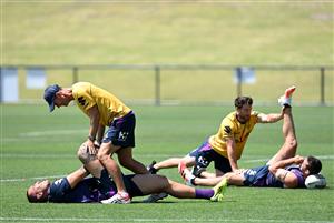 SUNSHINE COAST, AUSTRALIA - OCTOBER 21: Nelson Asofa-Solomona and Dale Finucane stretch during a Melbourne Storm NRL training session at Sunshine Coast Stadium on October 21, 2020 in Sunshine Coast, Australia. (Photo by Bradley Kanaris/Getty Images)