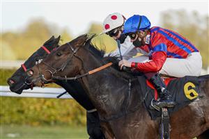 SUNBURY, ENGLAND - OCTOBER 20: Rob Hornby riding Autumn Trail (nearest) win The Unibet Thanks The Frontline Workers Handicap at Kempton Park Racecourse on October 20, 2020 in Sunbury, England. Owners are allowed to attend if they have a runner at the meeting otherwise racing remains behind closed doors to the public due to the Coronavirus pandemic. (Photo by Alan Crowhurst/Getty Images)