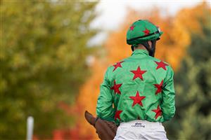 SUNBURY, ENGLAND - OCTOBER 20: A general view as a jockey makes his way to the track at Kempton Park Racecourse on October 20, 2020 in Sunbury, England. Owners are allowed to attend if they have a runner at the meeting otherwise racing remains behind closed doors to the public due to the Coronavirus pandemic. (Photo by Alan Crowhurst/Getty Images)