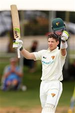 ADELAIDE, AUSTRALIA - OCTOBER 21: Tim Paine of the Tasmanian Tigers bats celebrates after reaching his century during day three of the Sheffield Shield match between South Australia and Tasmania at Karen Rolton Oval on October 21, 2020 in Adelaide, Australia. (Photo by Daniel Kalisz/Getty Images)