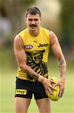 GOLD COAST, AUSTRALIA - OCTOBER 22: Oleg Markov of the Tigers kicks during a Richmond Tigers AFL training session at Metricon Stadium on October 22, 2020 in Gold Coast, Australia. (Photo by Quinn Rooney/Getty Images)