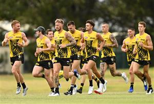 GOLD COAST, AUSTRALIA - OCTOBER 22: The Tigers warm up during a Richmond Tigers AFL training session at Metricon Stadium on October 22, 2020 in Gold Coast, Australia. (Photo by Quinn Rooney/Getty Images)