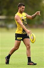 GOLD COAST, AUSTRALIA - OCTOBER 22: Jack Graham of the Tigers kicks during a Richmond Tigers AFL training session at Metricon Stadium on October 22, 2020 in Gold Coast, Australia. (Photo by Quinn Rooney/Getty Images)