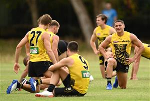 GOLD COAST, AUSTRALIA - OCTOBER 22: Dion Prestia of the Tigers talks to team mates during a Richmond Tigers AFL training session at Metricon Stadium on October 22, 2020 in Gold Coast, Australia. (Photo by Quinn Rooney/Getty Images)