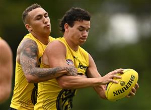 GOLD COAST, AUSTRALIA - OCTOBER 22: Daniel Rioli of the Tigers is tackled by Shai Bolton of the Tigers during a Richmond Tigers AFL training session at Metricon Stadium on October 22, 2020 in Gold Coast, Australia. (Photo by Quinn Rooney/Getty Images)