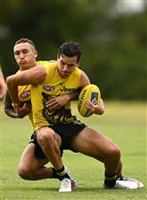 GOLD COAST, AUSTRALIA - OCTOBER 22: Daniel Rioli of the Tigers is tackled by Shai Bolton of the Tigers during a Richmond Tigers AFL training session at Metricon Stadium on October 22, 2020 in Gold Coast, Australia. (Photo by Quinn Rooney/Getty Images)