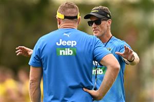 GOLD COAST, AUSTRALIA - OCTOBER 22: Tigers head coach Damien Hardwick chats to Justin Leppitsch the assistant coach of the Tigers during a Richmond Tigers AFL training session at Metricon Stadium on October 22, 2020 in Gold Coast, Australia. (Photo by Quinn Rooney/Getty Images)