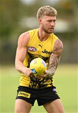 GOLD COAST, AUSTRALIA - OCTOBER 22: Nathan Broad of the Tigers handballs during a Richmond Tigers AFL training session at Metricon Stadium on October 22, 2020 in Gold Coast, Australia. (Photo by Quinn Rooney/Getty Images)