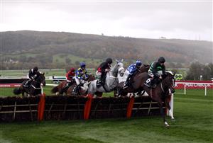 CHELTENHAM, ENGLAND - OCTOBER 23: Runners and riders including eventual winner Does He Know ridden by jockey David Bass (second right) clear a fence during the Ballymore Novices' Hurdle (GBB Race) at Cheltenham Racecourse on October 23, 2020 in Cheltenham, England. (Photo by David Davies - Pool / Getty Images)