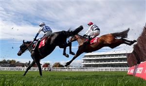 CHELTENHAM, ENGLAND - OCTOBER 23: Galvin ridden by jockey Robbie Power (eventual winner background) and Doctor Duffy with jockey Jonathan Burke clear a fence during the (Old) Matchbook Better Way To Bet Novices' Chase (GBB Race) at Cheltenham Racecourse on October 23, 2020 in Cheltenham, England. (Photo by David Davies - Pool / Getty Images)