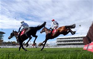 CHELTENHAM, ENGLAND - OCTOBER 23: Galvin ridden by jockey Robbie Power (eventual winner background) and Doctor Duffy with jockey Jonathan Burke clear a fence during the (Old) Matchbook Better Way To Bet Novices' Chase (GBB Race) at Cheltenham Racecourse on October 23, 2020 in Cheltenham, England. (Photo by David Davies - Pool / Getty Images)
