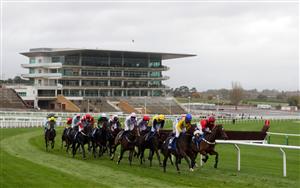 CHELTENHAM, ENGLAND - OCTOBER 24: Runner and riders go round a bend in front of empty stands during the Pertemps Network Handicap Hurdle at Cheltenham Racecourse on October 24, 2020 in Cheltenham, England. (Photo by David Davies - Pool/Getty Images)