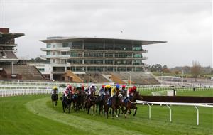 CHELTENHAM, ENGLAND - OCTOBER 24: Runner and riders go round a bend in front of empty stands during the Pertemps Network Handicap Hurdle at Cheltenham Racecourse on October 24, 2020 in Cheltenham, England. (Photo by David Davies - Pool / Getty Images)