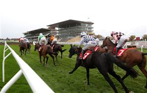 CHELTENHAM, ENGLAND - OCTOBER 24: Runners and riders in front of empty stands during the Pertemps Network Handicap Hurdle at Cheltenham Racecourse on October 24, 2020 in Cheltenham, England. (Photo by David Davies - Pool/Getty Images)