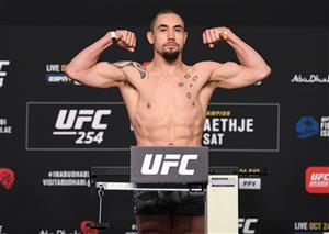 ABU DHABI, UNITED ARAB EMIRATES - OCTOBER 23: In this handout image provided by UFC, Robert Whittaker of Australia poses on the scale during the UFC 254 weigh-in on October 23, 2020 on UFC Fight Island, Abu Dhabi, United Arab Emirates. (Photo by Josh Hedges/Zuffa LLC via Getty Images)