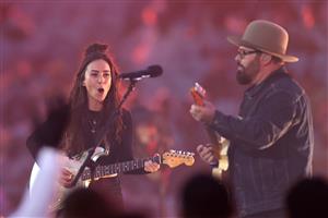 SYDNEY, AUSTRALIA - OCTOBER 25: Andrew Farriss performs with Amy Shark before the 2020 NRL Grand Final match between the Penrith Panthers and the Melbourne Storm at ANZ Stadium on October 25, 2020 in Sydney, Australia. (Photo by Cameron Spencer/Getty Images)